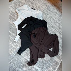 3 boohoo long sleeve body suits size 2